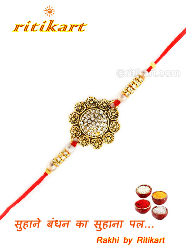 Golden Color flower design Rakhi with white stone