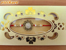 Golden Color flower design Rakhi with white stone