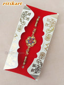 Golden Flower with Blue Stone Designer Rakhi