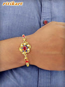 Golden Flower with Blue Stone Designer Rakhi