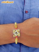 Golden Omm inside Metal Swastik Rakhi
