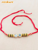 Designer Crystal with Golden and Green Beads Rakhi