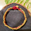 Ancient Bracelet with Brass Spikes embedded in Red Thread